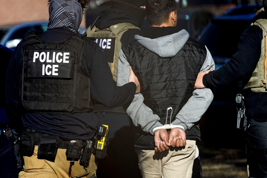 Agents with the Immigration and Customs Enforcement detain a man after conducting a raid at the Cedar Run apartment complex in Denver Feb. 5, 2025. A new Marquette Law School Poll released April 2 found public perception of Trump administration policies mixed, with just 42% of U.S. adults saying the country is going in the right direction.