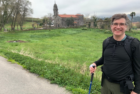 Joe Ruff stands on a country road near Caldas de Reis in Spain during his March 19-April 1 Camino de Santiago pilgrimage. In the background is one of the many Catholic churches that can be found across Spain. Ruff and his brother, Paul, walked 80 miles from March 22 to March 28 to the Catedral de Santiago de Compostela, which tradition holds is the burial place of St. James the Apostle. Santiago de Compostela is the capital of northwest Spain’s Galicia region.