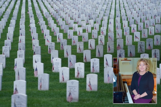 Gravestones adorned with American Flags are seen at Arlington National Cemetery on Memorial Day in Arlington, Va., May 27, 2024. Each year on Memorial Day, celebrated on the last Monday of May, the nation pays tribute to U.S. military service members who have died in war.
