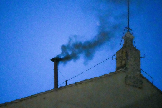 Black smoke billows from the chimney atop the Sistine Chapel May 7, 2025, on the first day of the conclave at the Vatican.