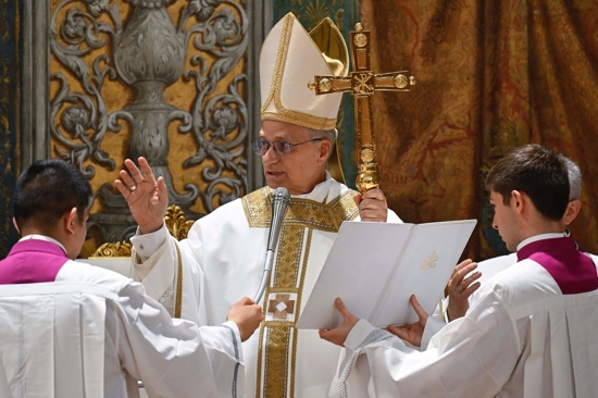 Pope Leo XIV offers a blessing during his first Mass as pope with the cardinals who elected him in the Sistine Chapel at the Vatican May 9, 2025.