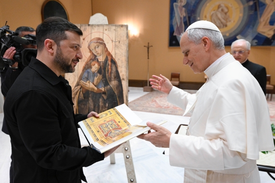 Pope Leo XIV receives a gift from Ukrainian President Volodymyr Zelenskyy during a meeting at the Vatican May 18, 2025.