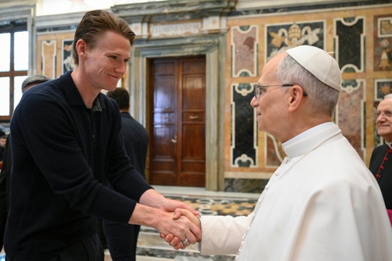 Pope Leo XIV greets Napoli midfielder Scott McTominay during a meeting with the team at the Vatican May 27, 2025, following their Serie A title win. 
