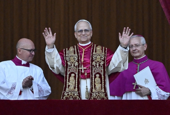 Cardinal Robert Francis Prevost, who has chosen the papal name Leo XIV, appears on the central balcony of St. Peter's Basilica at the Vatican May 8, 2025, following his election during the conclave. He is the first American pope in history.