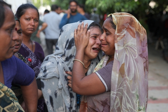 A family member cries upon hearing the news of her brother who died when the Air India Boeing 787 Dreamliner plane crashed in Ahmedabad, India, June 12, 2025. The flight crashed midday shortly after takeoff from Ahmedabad airport with more than 240 people on board.