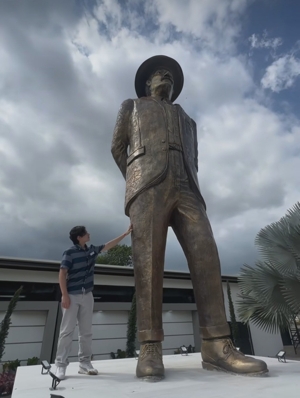 Josué Benjamín Figueroa, 16, is seen May 24, 2025, next to the statue he sculptured of Blessed José Gregorio Hernández. It's the world's tallest sculpture of the future saint, permanently installed in Tocuyito, Venezuela, in Carabobo state. Blessed José Gregorio, who will be canonized Oct. 19, was a 19th-century medical doctor who modernized medicine in Venezuela and was known for his fervent faith and willingness to serve the poor.