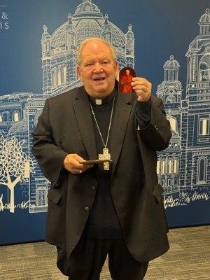 Archbishop Bernard Hebda holds a letter written by St. John Henry Newman that recently came into his possession. The Vatican announced July 31 that Pope Leo XIV will name the saint a doctor of the Church. 