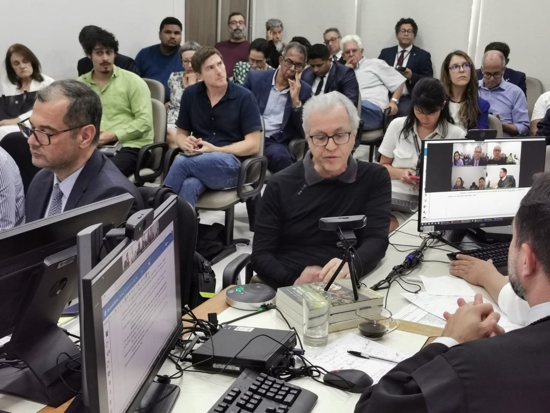 Father Ricardo Rezende is seen with workers for the Volkswagen-operated Vale do Rio Cristalino Ranch in the city of Santana do Araguaia, in the Brazilian Amazon, during the May 30, 2025, court hearing in Redenção, Pará state, Brazil. The farm's administration was accused by workers of practices that are common in situations of the crime of slave labor in Brazil, like the undue indebtedness of laborers and the use of violence. Labor prosecutors are asking for a compensation of more than $29 million.