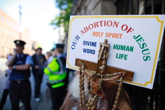 A file photo shows a sign with a crucifix and rosary during a pro-life demonstration outside the Irish Parliament in Dublin. Statistics released by the Department of Health in Ireland showed that abortions in Ireland spiked in the space of just five years.