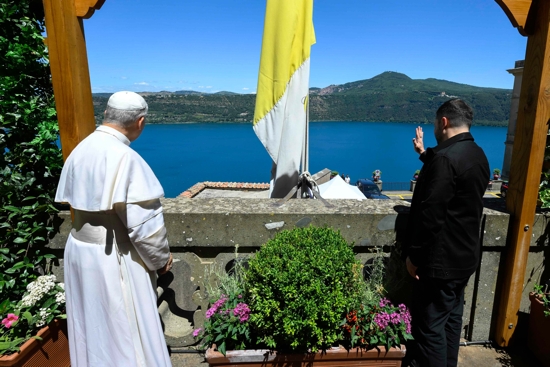 Pope Leo XIV and Ukrainian President Volodymyr Zelenskyy wave from the papal villa in Castel Gandolfo, Italy, during their meeting July 9, 2025.