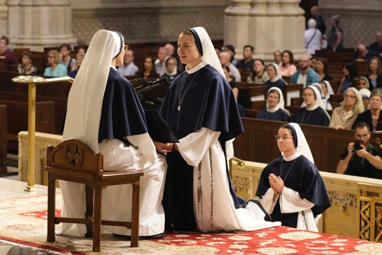 Sister of Life Beata Victoria kneels before Mother Mary Concepta, superior general of the Sisters of Life, as she professes her perpetual vows during Mass at St. Patrick's Cathedral in New York City Aug. 6, 2025. Two other members of the religious community also professed their perpetual vows during the liturgy. 