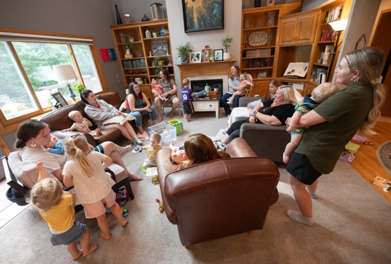 Mothers and their children gather for a small group meeting Aug. 8. This gathering featured 10 moms (four of whom are pregnant) and 18 children.