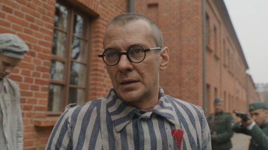 Polish actor Marcin Kwasny portrays Polish Conventual Franciscan Father Maximilian Kolbe at the Nazis' main Auschwitz concentration camp, where he died Aug. 14, 1941. The priest's last moments are the core story of a new movie about him titled "Triumph of the Heart" by American filmmaker Anthony D'Ambrosio, which premiered Aug. 13, 2025, in Poland and is set to arrive in U.S. theaters Sept. 12. Father Kolbe was canonized in 1982.