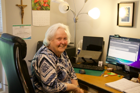 School Sister of Notre Dame Kathleen Storms, who is leading efforts to coordinate pilgrimages for the Laudato Si’ Movement Minnesota Chapter, works from her West St. Paul home Aug. 25 as she helps prepare for upcoming pilgrimages.