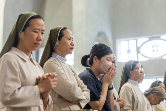 Religious sisters and others pray during Mass Aug. 6, 2025, at the World Peace Memorial Cathedral in Hiroshima, Japan, for the victims of the 1945 atomic bombing. The Mass was part of a "Pilgrimage of Peace" by four U.S. archbishops and U.S. Catholic university leaders and students to Hiroshima and Nagasaki to pray and dialogue for peace on the 80th anniversary of when the atomic bombs were dropped on those cities on Aug. 6 and 9, 1945.