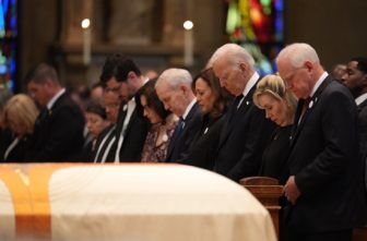 From right, Gov. Tim Walz and his wife, Gwen, former U.S. President Joe Biden, former U.S. Vice President Kamala Harris, former Minnesota Gov. Mark Dayton, Lt. Gov. Peggy Flanagan, Tom Weber and Minnesota Attorney General Keith Ellison bow their heads in prayer during the June 29 funeral for Melissa and Mark Hortman. The funeral was held at the Basilica of St. Mary in Minneapolis.