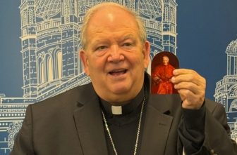 Archbishop Bernard Hebda holds a letter written by St. John Henry Newman that recently came into his possession. The Vatican announced July 31 that Pope Leo XIV will name the saint a doctor of the Church.