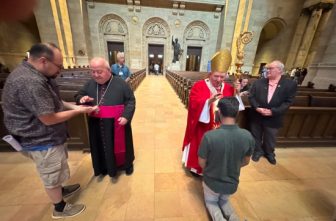 Archbishop Samir Nassar, left, and Archbishop Bernard Hebda bestow blessings after the June 29 evening Mass of the solemnity of Sts. Peter and Paul at the Cathedral of St. Paul in St. Paul.  JOE RUFF  |  THE CATHOLIC SPIRIT