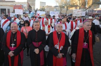 Archbishop John C. Wester of Santa Fe, N.M., (right) takes part in a demonstration in El Paso, Texas, against mass deportation alongside Bishop Peter Baldacchino of Las Cruces, N.M.; Archbishop Gustavo García-Siller of San Antonio and Bishop Mark J. Seitz of El Paso. Archbishop Wester promulgated June 26, 2025, a letter by 40 leaders of several faiths, calling the budget bill before Congress a "moral failure" that should be opposed.
