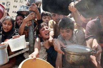 Palestinians gather to receive food from a charity kitchen amid a hunger crisis in the central Gaza Strip July 29, 2025. Despite daunting odds, Catholic Relief Services and its on-the-ground partners have managed to deliver aid to 1.7 million people in Gaza since 2023, according to new data.