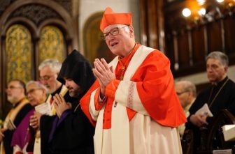 New York Cardinal Timothy M. Dolan joins the assembly in reciting the Nicene Creed during an ecumenical prayer service for peace in the world in honor of Mary, Mother of God, at Our Lady of Lebanon Maronite Cathedral in the Brooklyn Heights section of Brooklyn, N.Y., May 20, 2025. In a May 29 Wall Street Journal commentary, Cardinal Dolan said he is "stunned" that New York lawmakers "are on the verge of legalizing suicide," and he said he prays the governor "will step up to protect precious human life."