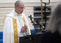 Father Dennis Zehren, pastor of Annunciation parish in Minneapolis, participated in the Aug. 27 prayer service at the Academy of Holy Angels in Richfield, only hours after a shooting at an all-school Mass at Annunciation killed two children and injured more than a dozen more people. DAVE HRBACEK | THE CATHOLIC SPIRIT