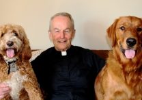 Father Murtaugh with his two dogs, Murphy, left, and Seamus.