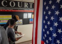 A migrant is detained by federal immigration officers at the U.S. immigration court in the Manhattan borough of New York City July 25, 2025.