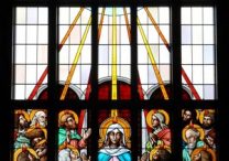 A stained-glass window at St. William Church in Waukesha, Wis., depicts Holy Spirit descending upon the apostles at Pentecost. The feast of Pentecost, often referred to as the birthday of the church, is celebrated on May 19 this year.