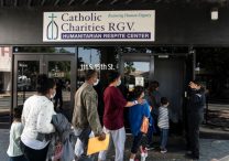 Migrants seeking asylum in the U.S. walk into a temporary humanitarian respite center run by Catholic Charities of the Rio Grande Valley in McAllen, Texas, April 8, 2021. Catholic Charities USA and the U.S. Conference of Catholic Bishops are among more than 200 NGOs named in a congressional probe, announced June 11, 2025, seeking to investigate aid to migrants its leaders call "inadmissible aliens" during former President Joe Biden's administration. (House probe on migrant aid)