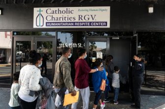 Migrants seeking asylum in the U.S. walk into a temporary humanitarian respite center run by Catholic Charities of the Rio Grande Valley in McAllen, Texas, April 8, 2021. Catholic Charities USA and the U.S. Conference of Catholic Bishops are among more than 200 NGOs named in a congressional probe, announced June 11, 2025, seeking to investigate aid to migrants its leaders call "inadmissible aliens" during former President Joe Biden's administration. (House probe on migrant aid)