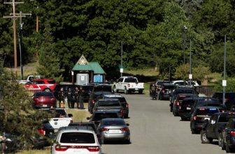 Law enforcement officers gather at Cherry Hill Park after multiple firefighters were attacked when responding to a fire in the Canfield Mountain area outside Coeur d'Alene, Idaho, June 29, 2025. Two firefighters were killed and at least one other was wounded when they were ambushed by sniper fire while responding to a blaze in a northern Idaho mountain community, as crews endured a barrage of gunfire over several hours that the governor called a "heinous" assault.
