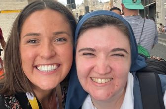 From left, Mackenzie Hunter and Sister Bethany of the Daughters of St. Paul outside the Auditorium Conciliazione — which hosted Jubilee of Digital Missionaries and Catholic Influencers sessions — in St. Peter's Square in Rome.