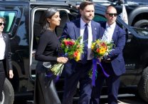Vice President JD Vance and his wife, Usha Vance, prepare to lay flowers at Annunciation church in Minneapolis Sept. 3.