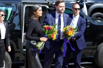 Vice President JD Vance and his wife, Usha Vance, prepare to lay flowers at Annunciation church in Minneapolis Sept. 3.