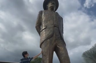 Josué Benjamín Figueroa, 16, is seen May 24, 2025, next to the statue he sculptured of Blessed José Gregorio Hernández. It's the world's tallest sculpture of the future saint, permanently installed in Tocuyito, Venezuela, in Carabobo state. Blessed José Gregorio, who will be canonized Oct. 19, was a 19th-century medical doctor who modernized medicine in Venezuela and was known for his fervent faith and willingness to serve the poor. OSV News photo/courtesy Josué Benjamín Figueroa Instagram