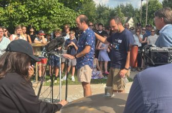 Jesse Merkel receives support as he talks Aug. 28 about his late son, Fletcher, in front of Annunciation church in Minneapolis. TOM HALDEN  |  OFFICE OF COMMUNICATIONS ARCHDIOCESE OF ST. PAUL AND MINNEAPOLIS