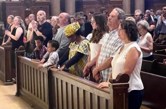 Members of the congregation pray at the Mass. DAVE HRBACEK  |  THE CATHOLIC SPIRIT