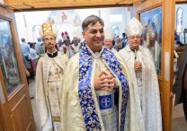 Father George Younes, center, exits the sanctuary at the end of his priest ordination liturgy at St. Maron in Minneapolis July 26. At left is Chorbishop Don Sawyer of Austin, Texas, and at right is Chorbishop Sharbel Maroun, pastor of St. Maron.  DAVE HRBACEK  | THE CATHOLIC SPIRIT