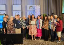 Micaela Verdeja, middle, stands with members of the St. Paul and Minneapolis ACCW who were in attendance at the NCCW convention in Orlando on Aug. 22.