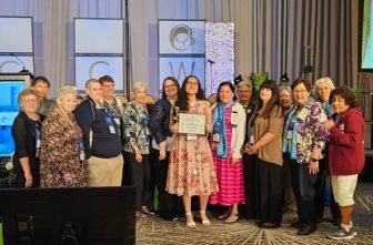 Micaela Verdeja, middle, stands with members of the St. Paul and Minneapolis ACCW who were in attendance at the NCCW convention in Orlando on Aug. 22.