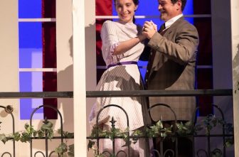 Diana and Chris Smith of St. Joseph in West St. Paul portray Ermengarde and her suiter, Andrew Kemper, in the play “The Matchmaker” by Thornton Wilder during a dress rehearsal at St. Agnes School in St. Paul June 14.  DAVE HRBACEK  |  THE CATHOLIC SPIRIT