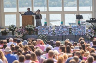 Harper Moyski’s parents, Mike Moyski and Jackie Flavin, address those gathered for Harper’s memorial service at the Lake Harriet Bandshell in Minneapolis Sept. 14. Harper was one of two students at Annunciation Catholic School in Minneapolis who died in the Aug. 27 shooting at Annunciation church.  DAVE HRBACEK  |  THE CATHOLIC SPIRIT