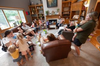 Mothers and their children gather for a small group meeting Aug. 8. This gathering featured 10 moms (four of whom are pregnant) and 18 children.