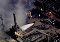 Firefighters spray water on the site of an explosion at US Steel's Clairton Coke Works plant in Clairton, Pa., Aug. 11, 2025, in this screengrab obtained from an aerial video.