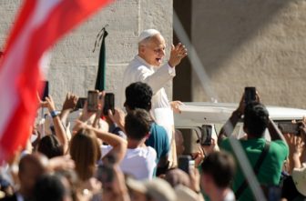 Pope Leo XIV greets visitors and pilgrims from the popemobile as he rides around St. Peter's Square at the Vatican before his weekly general audience July 30, 2025.