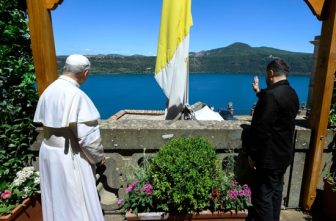 Pope Leo XIV and Ukrainian President Volodymyr Zelenskyy wave from the papal villa in Castel Gandolfo, Italy, during their meeting July 9, 2025.