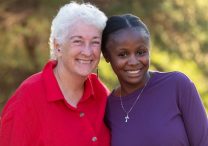 Carol McBrady, left, poses with Maria Mwena, who was born in Zambia. McBrady now is her legal guardian.