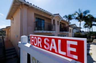 A for sale sign is shown for a residential home in Encinitas, Calif., July 25, 2025.