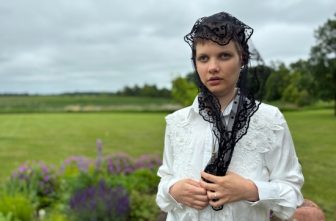 Claire Souilliart of Calais, France, stands in a garden June 14, 2025, near Stacy, Minn., after recounting her claims of two miraculous visits from Sister Annella Zervas, a Minnesota Benedictine whose cause for canonization may open soon, leading her to be cured of a blood disorder.